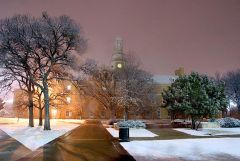 Administration building at night with snow