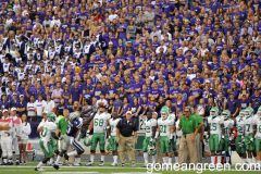 UNT Coach Dan McCarney in a sea of purple on the sidelines at K-State