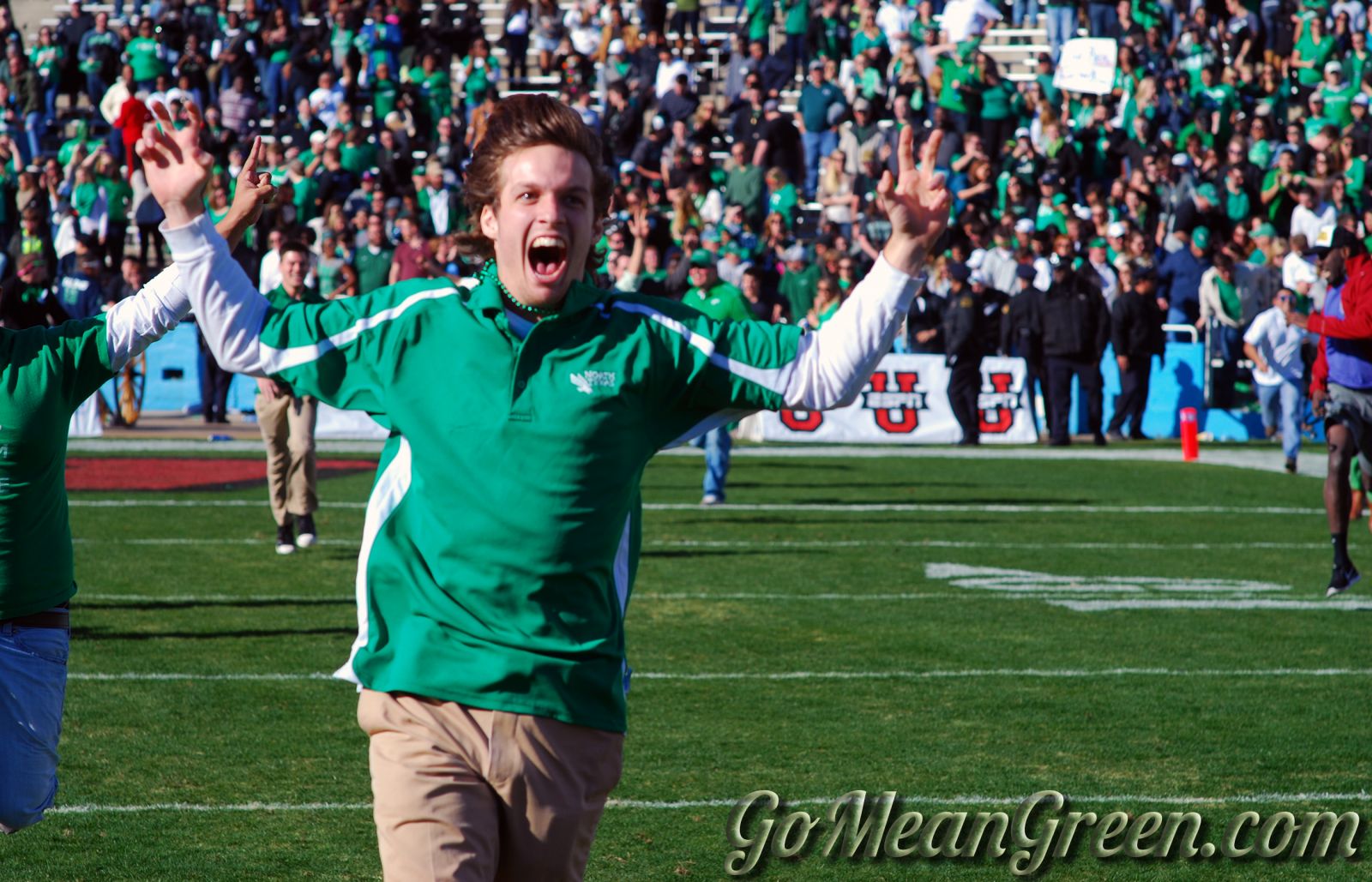 UNT students rush the Cotton Bowl field