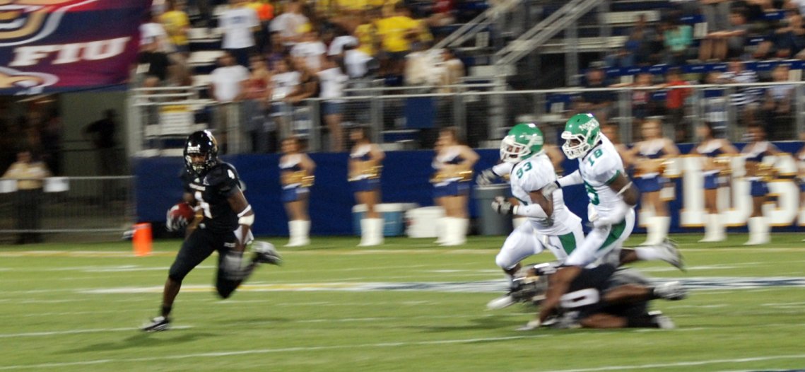 TWO UNT Defenders Give Chase to FIU's T.Y. Hilton (#4)