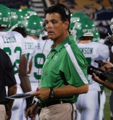 UNT Offensive Coordinator Chico Canales in the rain at FIU 2011