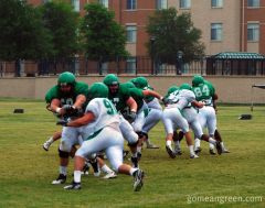 UNT OL Aaron Fortenberry applies forearm shiver to DT Ryan Boutwell
